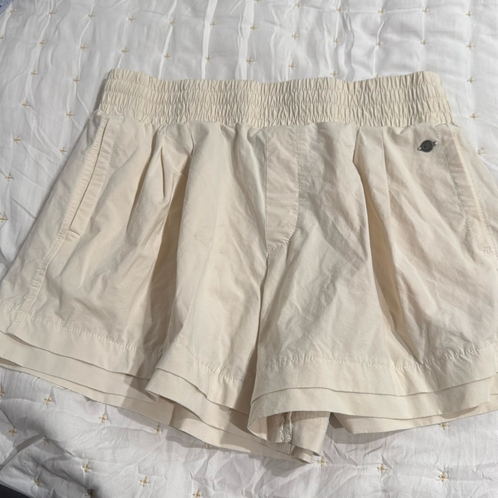 CALIA cream colored shorts. Pleated with pockets. Baggy legs.